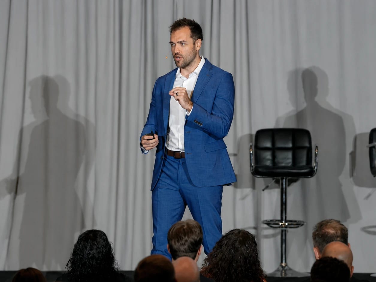 Nick Fischer teaching a room of chiropractors at a practice-growth seminar.