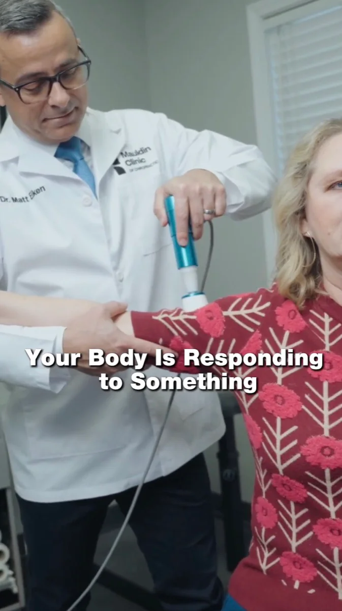 Mauldin Clinic Facebook video ad: the doctor treating a patient's arm with the caption Your Body Is Responding to Something